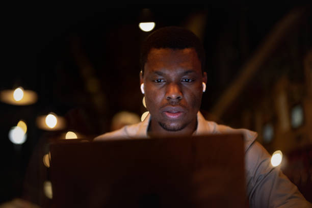 istock Tired Businessman Working Late At Night On His Laptop Computer 1806693658