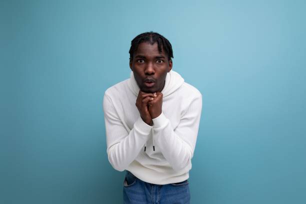 istock sad upset man young brunet american man thinking about solving problem on blue isolated background 1806710774