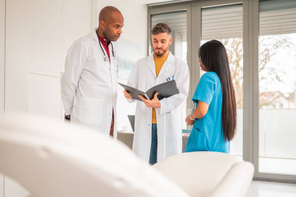 istock Multi-Ethnic Healthcare Staff Working In A Bright And Modern Doctor's Office 1806732786