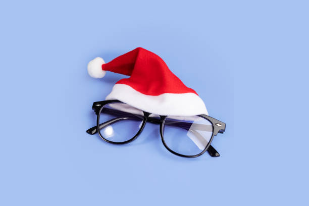 istock Glasses in santa hat, Vision correction, Transparent optics 1806750346