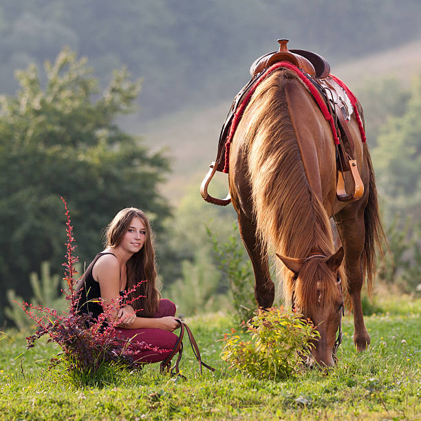 istock Young girl with a horse 180678747