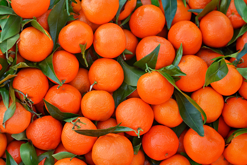 Bunch of fresh oranges at a market