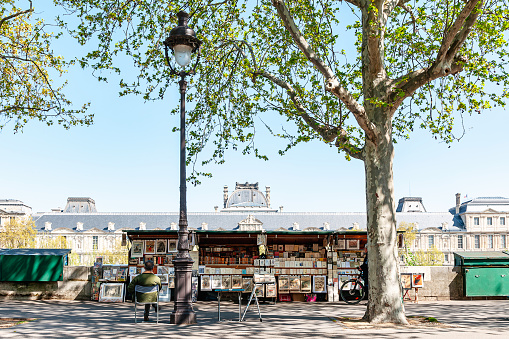 Bouquinistes of Paris are the famous outdoor booksellers that sell used books and some other vintage publications and souvenirs along the Seine river in Paris, France. April 19, 2023