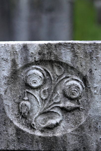 Cemetery Creepy Gray Stone Art At Dusk stock photo