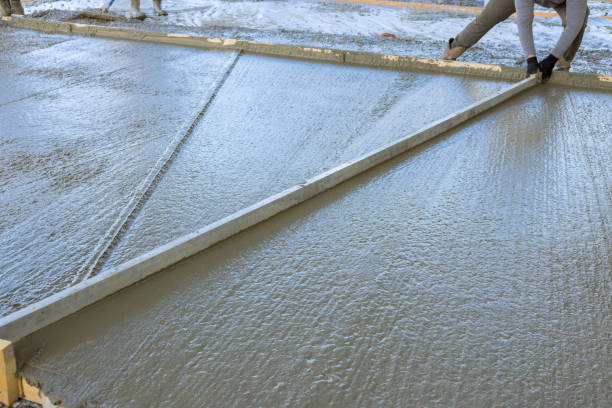 istock Concrete for a new house driveway has been poured from wet cement 1806835018