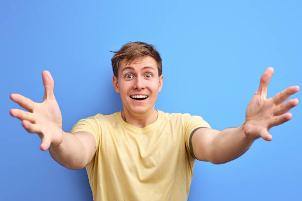 istock positive caucasian male spread arms, going to hug 1806855410