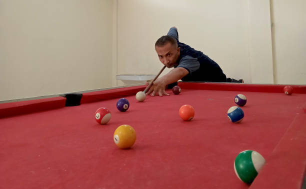 istock A man has a hobby of playing pool. 1806864839