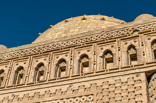 Close up on the Mausoleum of Ismmoil Samoniy, Uzbekistan, Bukhara. Background image of the historical building