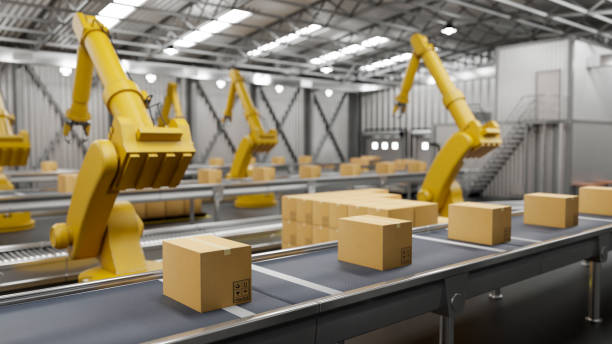istock A modern distribution warehouse with modern robot arms and cardboard boxes on a conveyor belt. 1806880560