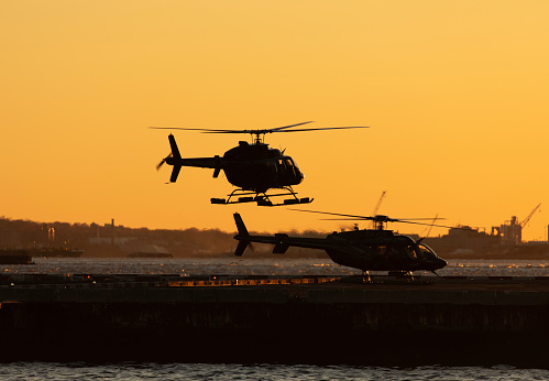 Helicopters at the heliport during sunset