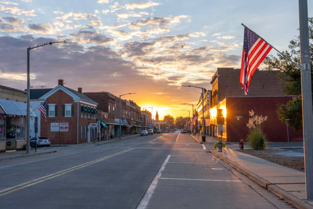 Main Street flags Staunton, IL, USA 09/06/2021: Representative of small-town America, Staunton attaches flags to lamp posts to mark special occasions. The flags on Main Street this day honor laborers on Labor Day. small town america stock pictures, royalty-free photos & images