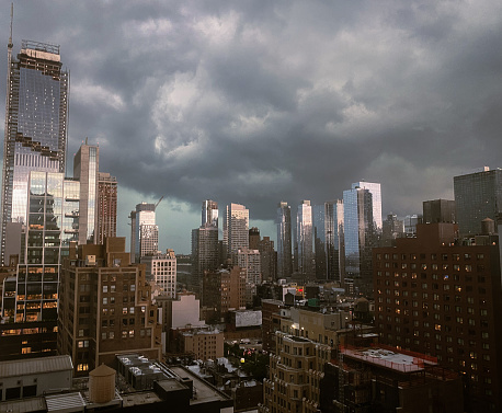A spring storm with dramatic clouds gather over  Manhattan, NY