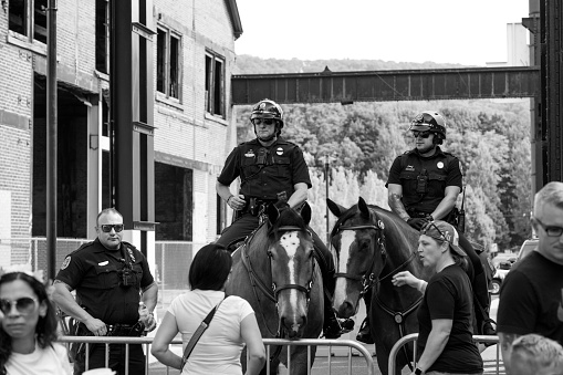 Bethlehem, USA - August 20, 2023. Policemen on duty at SteelStacks on Lehigh Valley Pride day, Bethlehem, Pennsylvania, USA
