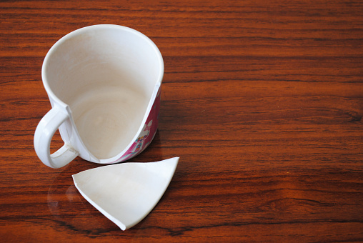 Isolated image of a broken melamine coffee cup.