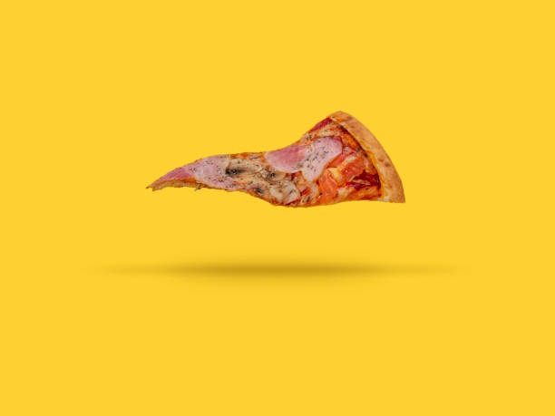 istock a flying slice of pizza on a yellow background 1806934806