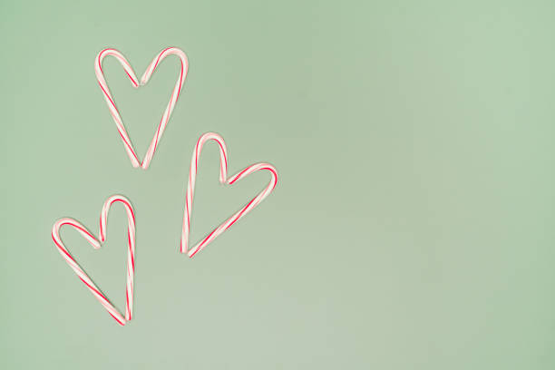 Three Candy Cane Hearts On a Green Background With Copy on the Right in Jersey City, New Jersey, United States