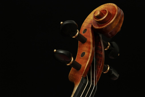 Violin scroll (head) on black background.BROWSE MORE LIKE-THEMED IMAGES IN THE FOLLOWING COLLECTIONS: