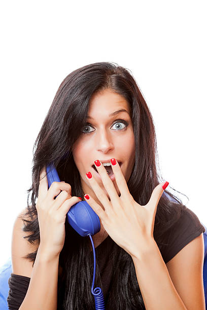 Funny woman on white background Beautiful funny young woman with phone on white background. late teens isolated on white one person cute stock pictures, royalty-free photos & images