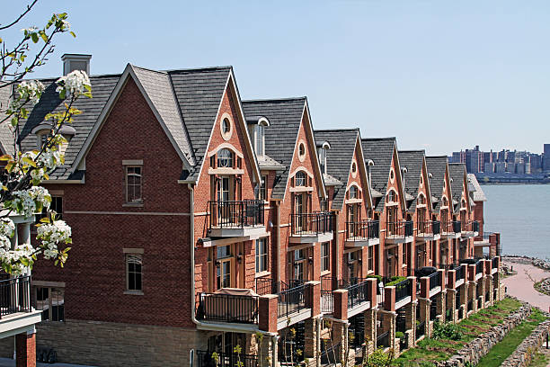 Townhouses in a row on the water with city scape - horizontal