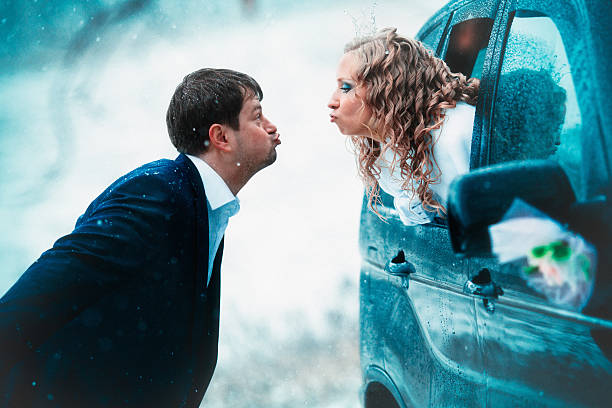 Fun and funny couple married in the winter stock photo