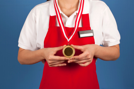 Businesswoman with a gold medal