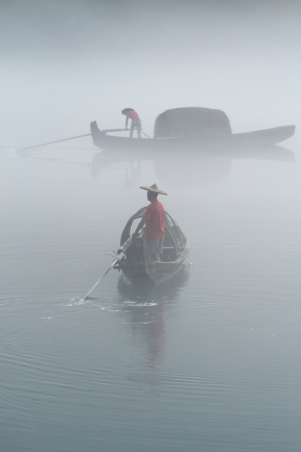 fishermen in the fog preparing to fishing.