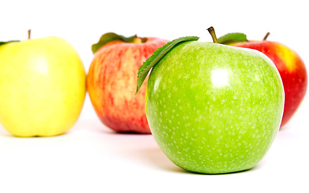 istock Green Apple in Front of Red and Apples 180695131