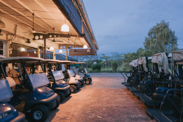 row of golf cart parking in golf course garage