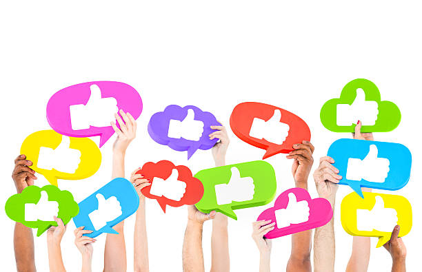 istock Several hands holding thumbs up signs in different colors 180695444