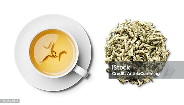 Cup Of Herbal Snow Dragon Tea And Tea Leaves Overhead Stock Photo - Download Image Now