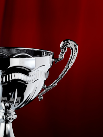 Silver cup with red background