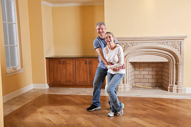 istock Couple laughing in new home 180696084