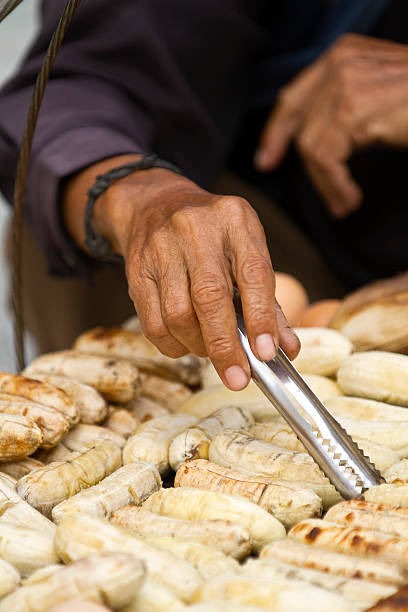 istock Close-up image of a man grilling some bananas 180696196