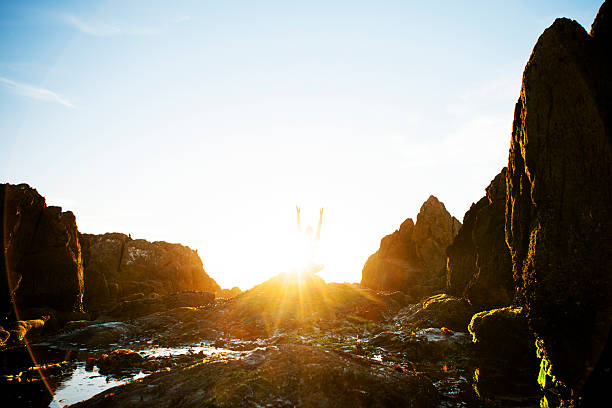 istock Female meditating on the rocks 180696703