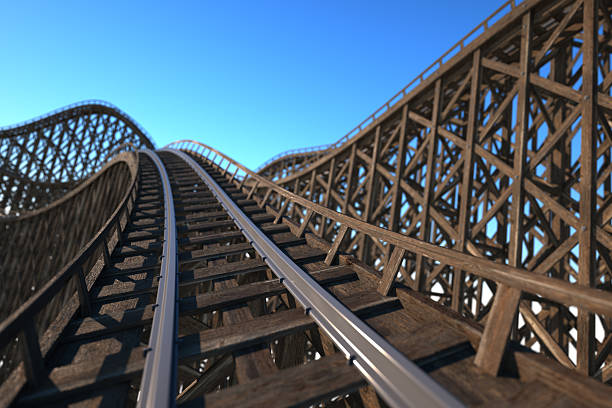 istock Front car view of a wooden roller coaster track 180696735