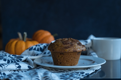 Closeup view of pumpkin muffin and coffee cup. in United States, District of Columbia, Washington