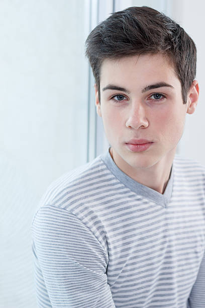 istock Portrait of smart young guy posing 180696866