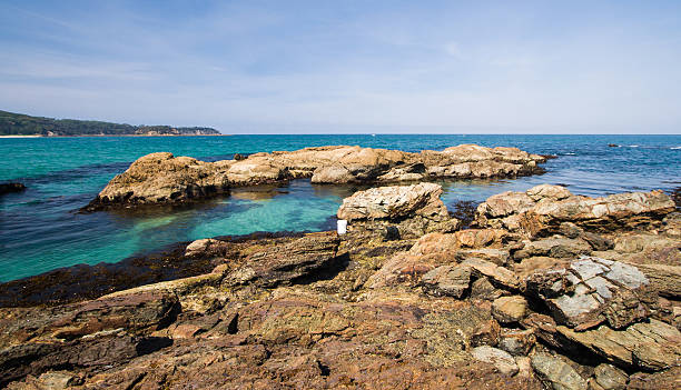 Tomakin Rocks The picturesque turquoise ocean around Tomakin on the Eurobodalla Coast in southern New South Wales.  Tomakin is a small beachside town just south of Batemans Bay along the eastern seaboard of Australia. shoalhaven photos stock pictures, royalty-free photos & images