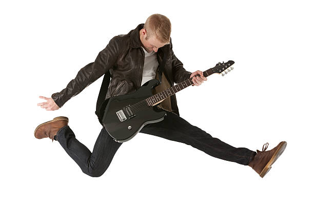istock Excited young man playing a guitar 180697722