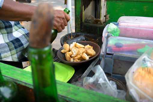 Tahu Gejrot. Sliced tofu served with red onion, chili, and sweet spicy sauce. Traditional Indonesia food