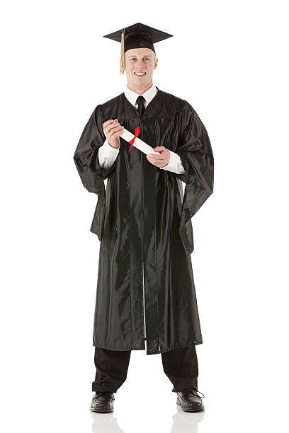 istock Young man in graduation gown with diploma 180697850