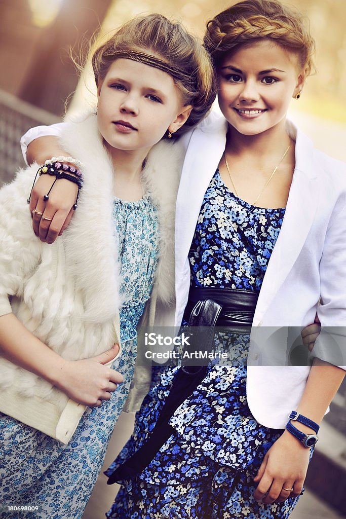 Two girls outdoors Two girls at a city street 8-9 Years Stock Photo