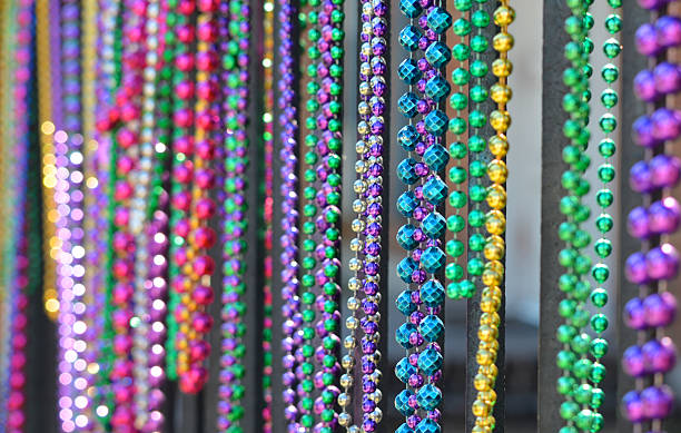 Mardi Gras beads in a row stock photo