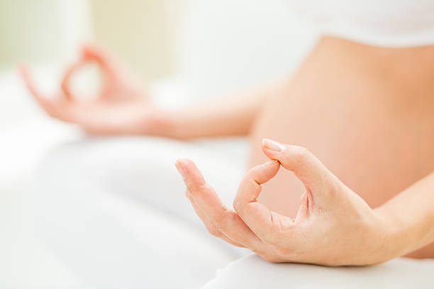 istock Woman seated in meditation pose 180698485