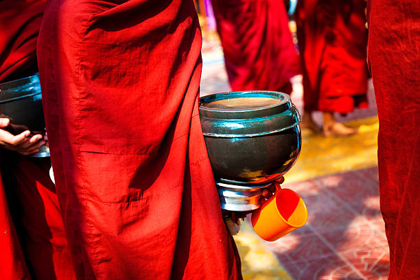 istock Buddhist Monks begging for food 180698697
