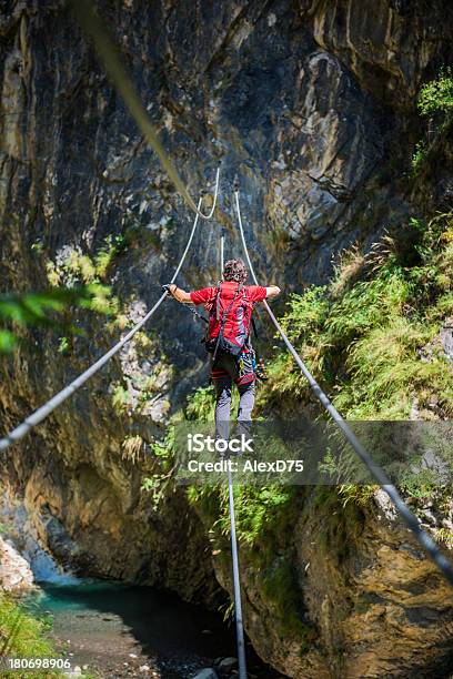 Climber On A Rope Bridge Stock Photo - Download Image Now - Dolomites, Via Ferrata, Italy