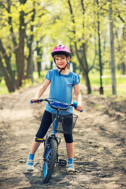 istock Little girl riding a bicycle 180698909