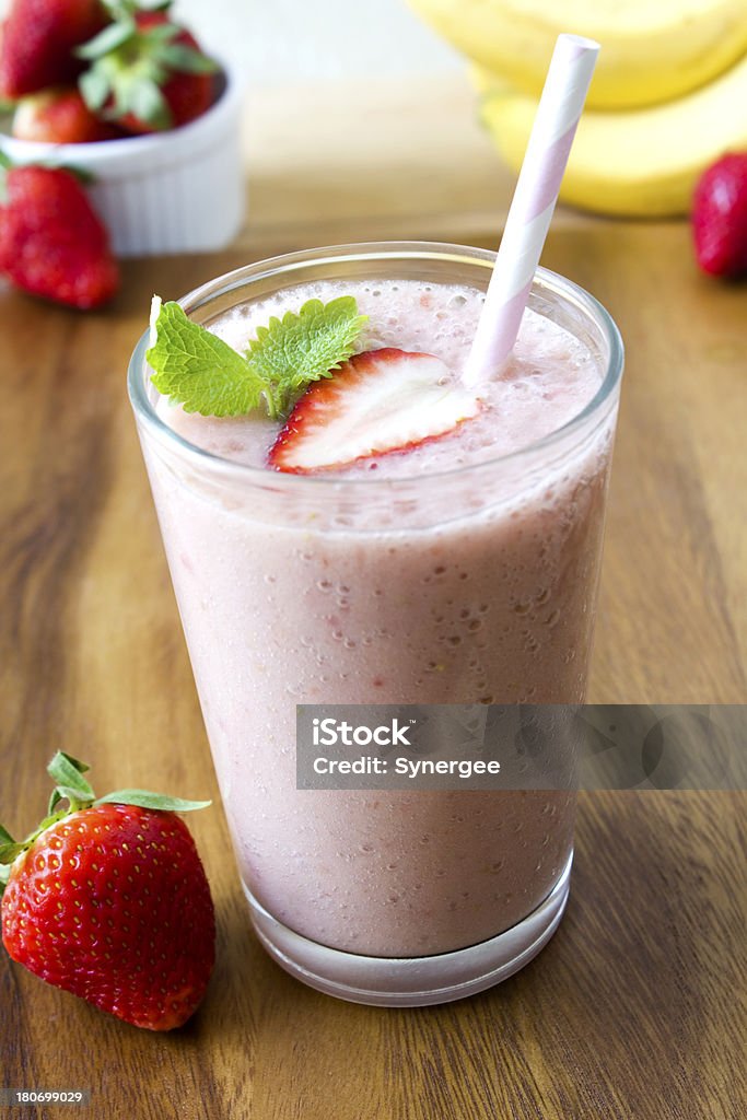 Strawberry smoothie "A fresh strawberry and banana smoothie, with fresh berries and a sprig of mint." Antioxidant Stock Photo