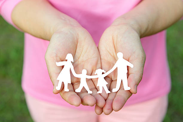 istock Paper family in hands 180699067