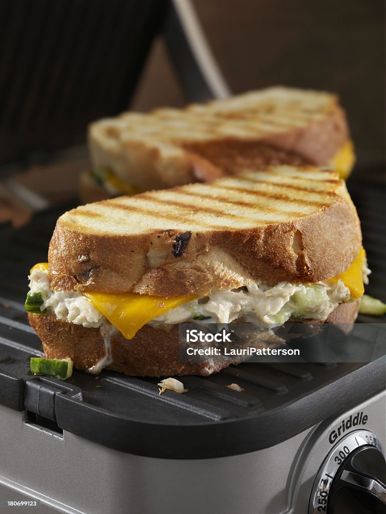 Tuna Melt Panini Tuna Melt Panini with Cheddar Cheese and Cucumbers on a Panini Grill - Photographed on Hasselblad H3D2-39mb Camera Melting Stock Photo